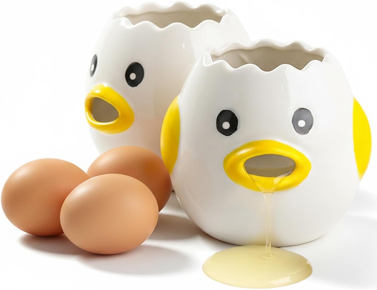 A ceramic egg yolk separator on a marble counter beside a cracked egg