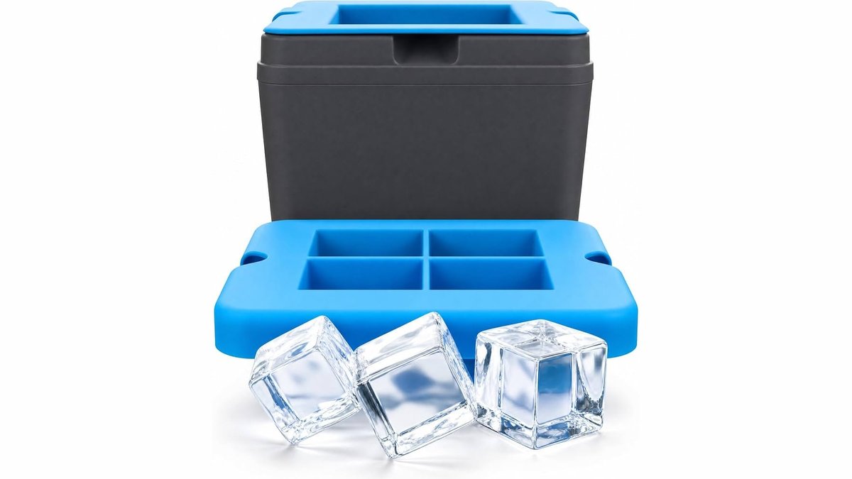 A clear ice cube maker tray with transparent ice cubes on a wooden countertop.
