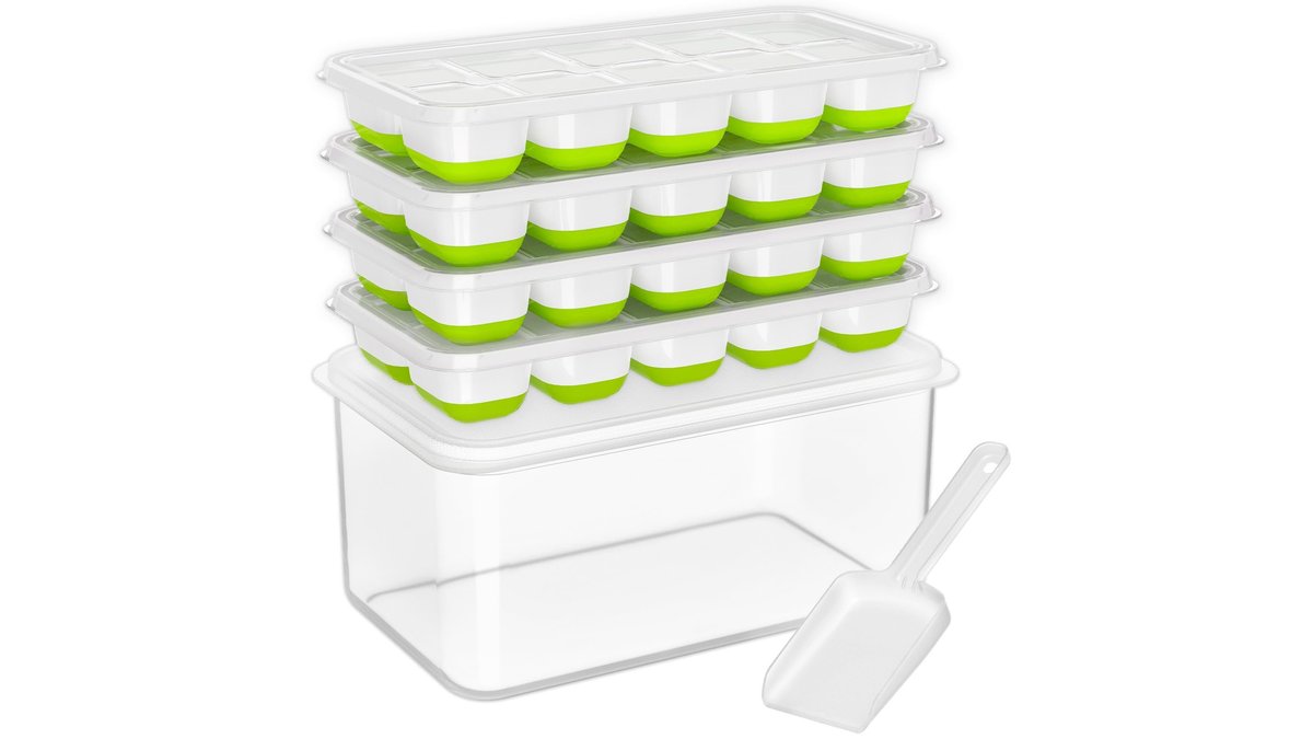 A clear stackable ice cube tray with storage bin on a marble countertop.