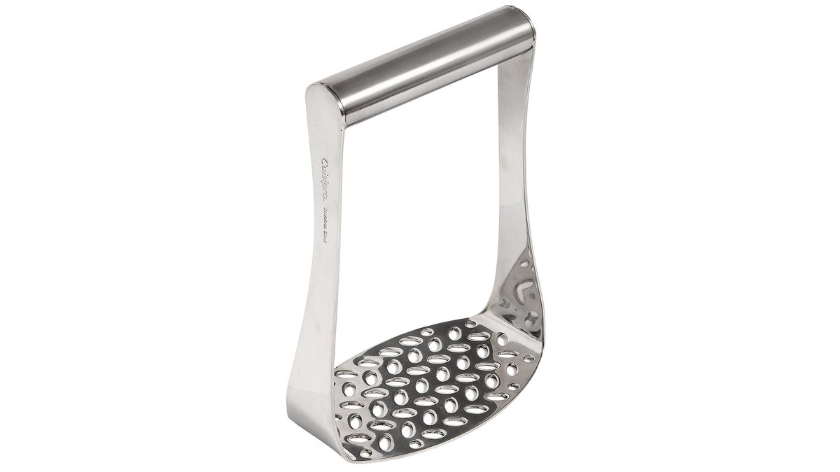 Heavy duty stainless steel potato masher rests on a wooden board near steaming potatoes.