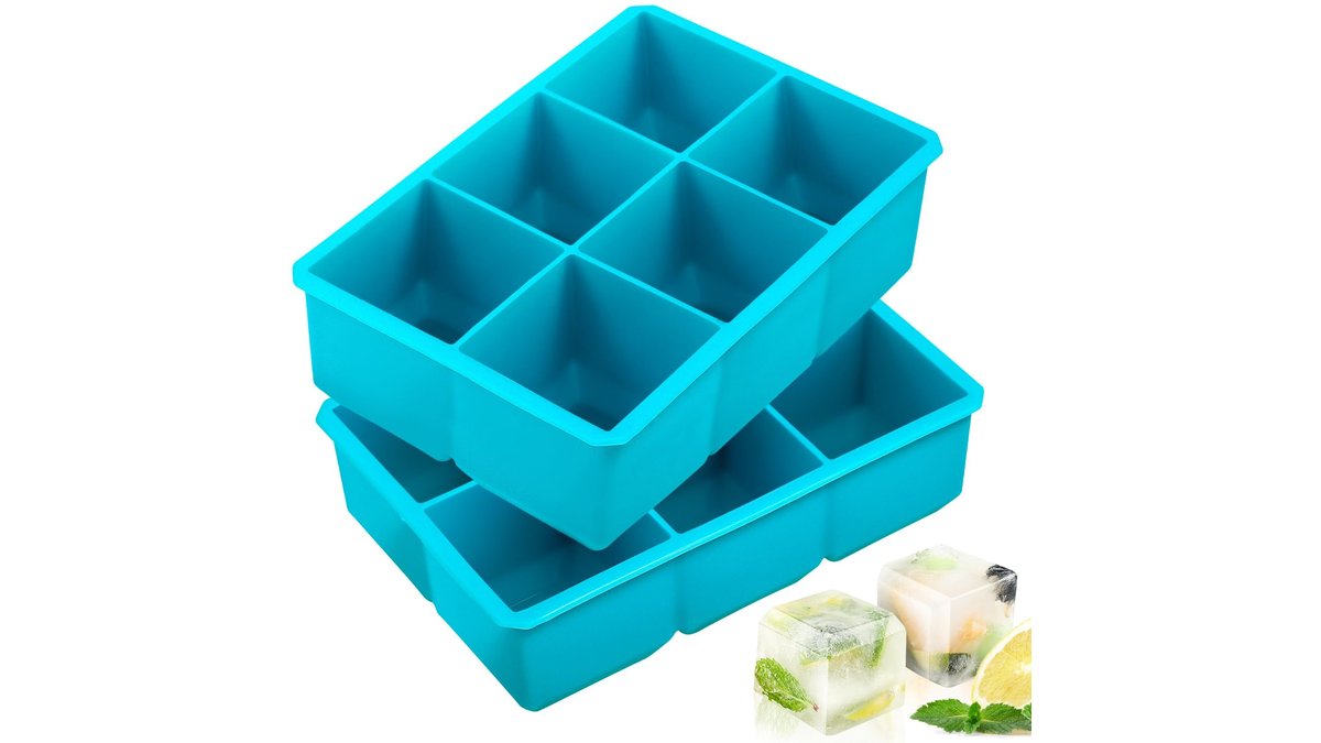 Large square silicone ice cube mold tray holding clear two-inch ice cubes.