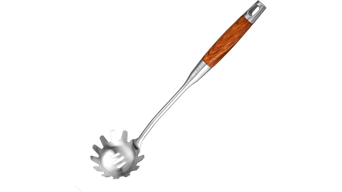A polished stainless steel pasta claw server resting in a colander of spaghetti.