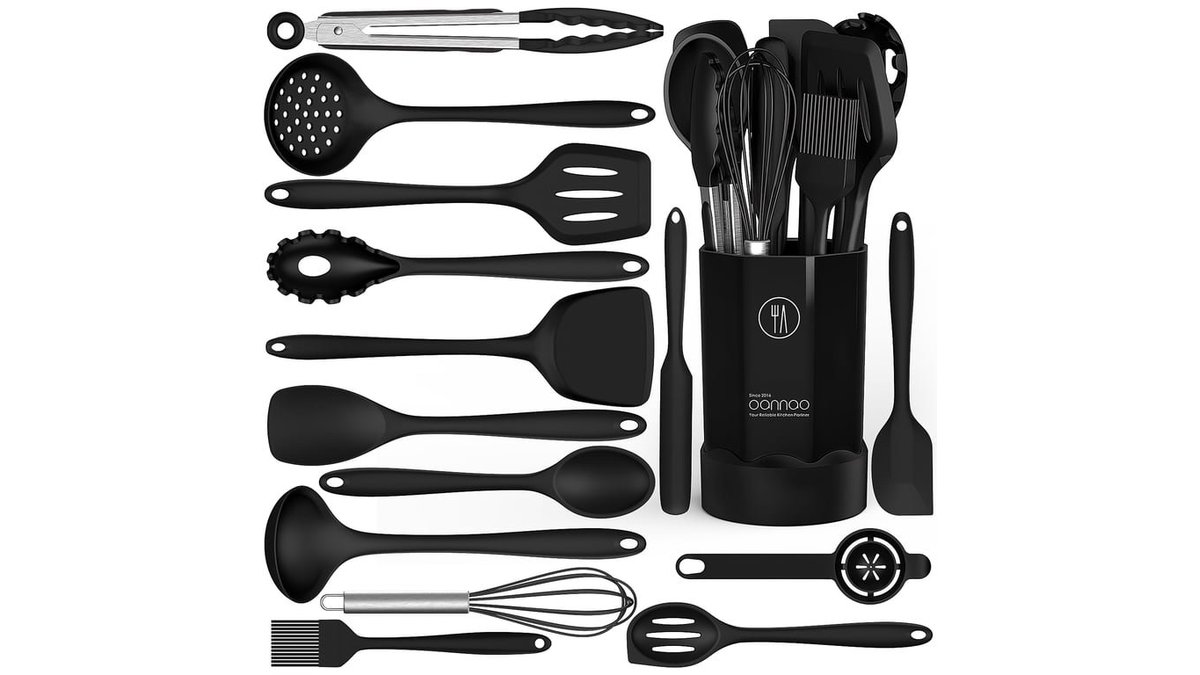 A professional set of heat resistant silicone cooking tools displayed in a modern kitchen.