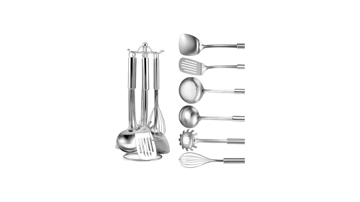 A professional stainless steel cooking tools set hanging neatly on a modern kitchen rack.