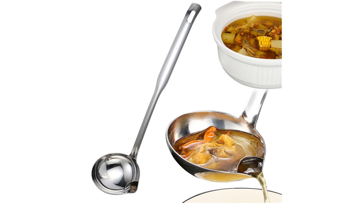 Stainless steel fat separator with bottom release on a marble kitchen counter.