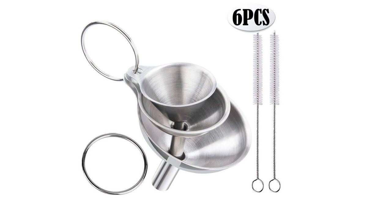 Stainless steel funnel set for kitchen on wooden countertop in soft light