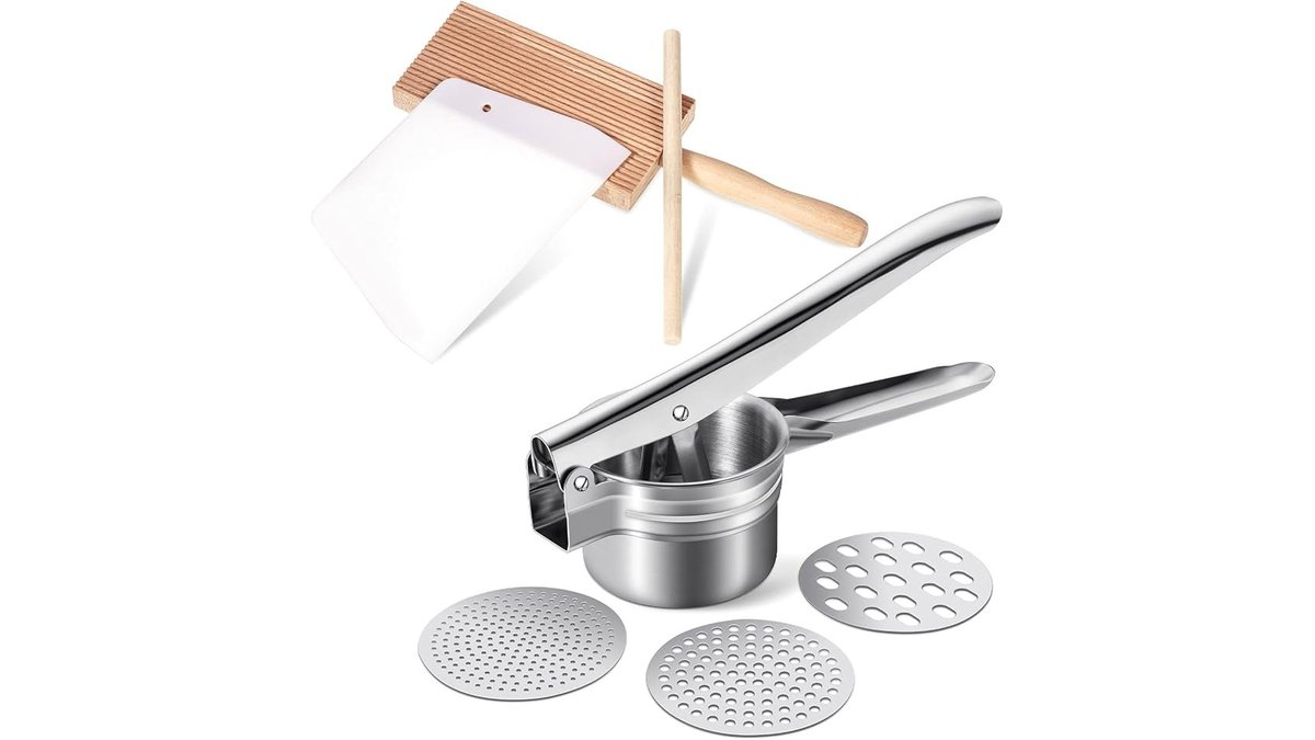 Stainless steel gnocchi board and paddle on a light wood counter in soft natural light.