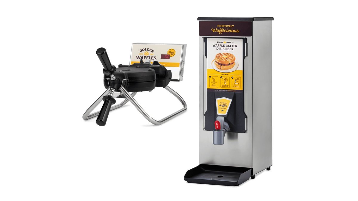 A stainless steel waffle batter dispenser sits on a marble counter beside a waffle maker.