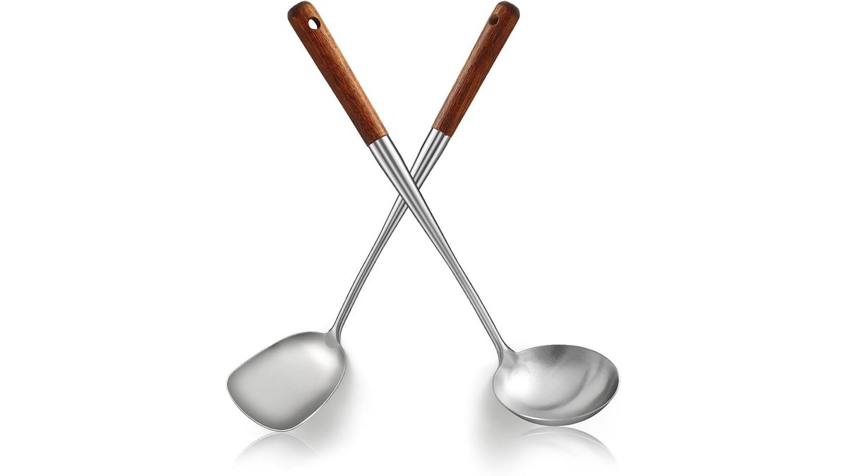Stainless steel wok spatula and ladle set on a counter.
