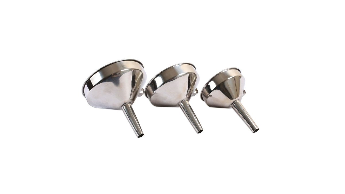 Three stainless steel kitchen funnels lined up on a wooden countertop